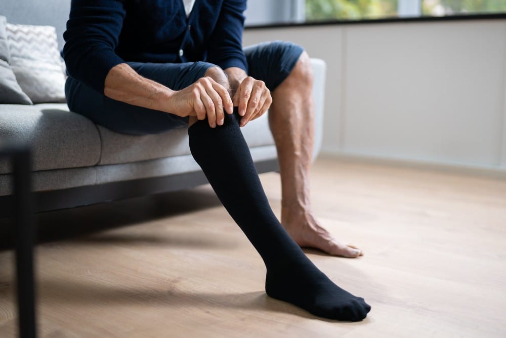 Putting on diabetic compression socks for diabetic foot care