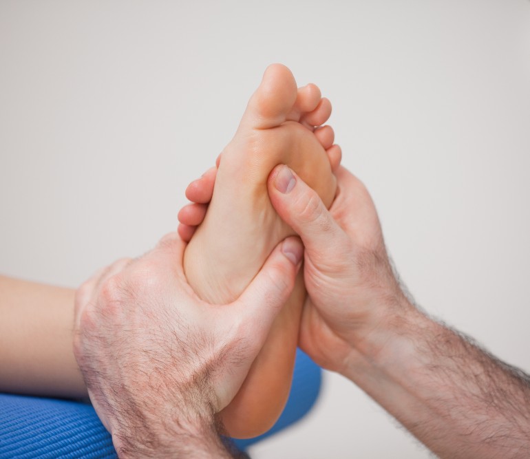Podiatrist examining a foot for nerve pain