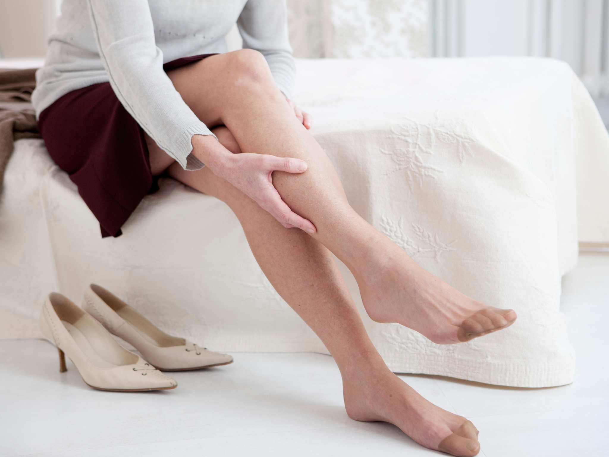 Senior woman suffering from leg pain
